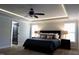 Well lit main bedroom with modern ceiling fan, recessed lighting and neutral colors at 335 Gwendolyn Way, Fuquay Varina, NC 27526
