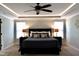 Well lit main bedroom with modern ceiling fan and neutral colors at 335 Gwendolyn Way, Fuquay Varina, NC 27526