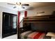 Bedroom with bunk beds and dark wood closet doors at 335 Gwendolyn Way, Fuquay Varina, NC 27526