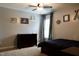 Cozy bedroom featuring natural light, ceiling fan, and ship themed decor at 335 Gwendolyn Way, Fuquay Varina, NC 27526