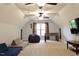 Spacious bonus room with vaulted ceiling, ceiling fans, and comfortable seating options at 335 Gwendolyn Way, Fuquay Varina, NC 27526