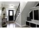 Welcoming entryway featuring staircase and convenient mudroom space at 335 Gwendolyn Way, Fuquay Varina, NC 27526