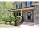 Beautiful two-story home with stone accents, lush landscaping and a welcoming front porch at 335 Gwendolyn Way, Fuquay Varina, NC 27526