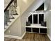 Mudroom features a built-in bench with dark wood drawers and hooks at 335 Gwendolyn Way, Fuquay Varina, NC 27526