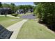 View of neighborhood street highlighting landscaped front yards and craftsman-style homes at 335 Gwendolyn Way, Fuquay Varina, NC 27526