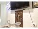 Close up of the wet bar, featuring dual tap handles and a stainless steel grate at 335 Gwendolyn Way, Fuquay Varina, NC 27526