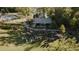 Aerial view of community event with live music, pool, and picturesque lake backdrop at 337 Sunset Hill Ln, Wendell, NC 27591