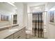 Bathroom with stylish fixtures, neutral walls, and shower-tub combination at 337 Sunset Hill Ln, Wendell, NC 27591