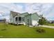Beautifully landscaped backyard with manicured lawn and charming exterior at 337 Sunset Hill Ln, Wendell, NC 27591