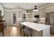Modern kitchen with stainless steel appliances, a center island, and stylish pendant lighting, perfect for culinary enthusiasts at 337 Sunset Hill Ln, Wendell, NC 27591