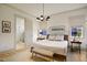 This main bedroom is bathed in natural light and has an ensuite bathroom and a wooden bed frame at 337 Sunset Hill Ln, Wendell, NC 27591
