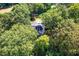 Aerial view of a home nestled among green trees at 3521 Banks Rd, Raleigh, NC 27603