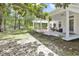 Sprawling backyard with mature trees and a covered porch that is perfect for outdoor entertaining at 3521 Banks Rd, Raleigh, NC 27603
