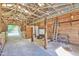 Spacious barn interior with open stalls, a concrete floor, and visible wood beam construction at 3521 Banks Rd, Raleigh, NC 27603