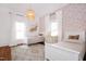 This bedroom features two twin beds, pink wallpaper, and hardwood floors at 3521 Banks Rd, Raleigh, NC 27603
