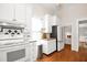 Bright kitchen features white cabinets, a wood countertop island, and stainless appliances at 3521 Banks Rd, Raleigh, NC 27603