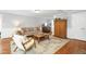 Open and airy living room featuring hardwood floors, a neutral color scheme, and comfortable seating at 3521 Banks Rd, Raleigh, NC 27603