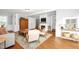 Bright and stylish living room featuring hardwood floors, comfortable seating, and a cozy fireplace at 3521 Banks Rd, Raleigh, NC 27603