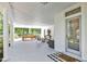 Spacious porch featuring an inviting entryway, string lights, seating, and charming decor elements at 3521 Banks Rd, Raleigh, NC 27603