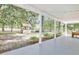 Covered porch overlooking landscaped yard with a decorative well and a spacious outdoor setting at 3521 Banks Rd, Raleigh, NC 27603