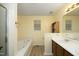 Bathroom featuring tub, single vanity, and medicine cabinet at 3521 Piedmont Dr, Raleigh, NC 27604