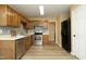 Well-equipped kitchen with stainless steel appliances, white cabinets, and a view into the adjacent dining room at 3521 Piedmont Dr, Raleigh, NC 27604