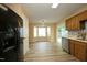 View of a modern eat-in kitchen, featuring stainless steel appliances, and a dining area with a bay window at 3521 Piedmont Dr, Raleigh, NC 27604
