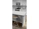 Modern kitchen featuring a center island with seating, stainless steel appliances, and stylish white cabinetry at 3703 Rosebush Dr, Zebulon, NC 27597