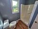Bathroom with neutral wall, shower, and a window to let in natural light at 3785 Little Creek Church Rd, Clayton, NC 27520