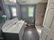 Beautiful bathroom with newly tiled shower and gray vanity at 3785 Little Creek Church Rd, Clayton, NC 27520