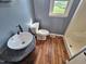 Updated bathroom with sleek vessel sink, modern fixtures, and a convenient shower at 3785 Little Creek Church Rd, Clayton, NC 27520