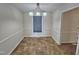Bright dining room featuring neutral walls, decorative chandelier, and tiled flooring at 3785 Little Creek Church Rd, Clayton, NC 27520