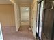 Inviting home foyer with carpeted flooring and a view into the dining area at 3785 Little Creek Church Rd, Clayton, NC 27520