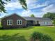 Charming single-story home with brick and vinyl siding, a well-manicured lawn, and a classic welcoming entrance at 3785 Little Creek Church Rd, Clayton, NC 27520