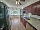 Eat in kitchen with warm cabinets and granite countertops at 3785 Little Creek Church Rd, Clayton, NC 27520