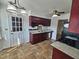 Galley kitchen with warm cabinets, tile floor, and breakfast nook at 3785 Little Creek Church Rd, Clayton, NC 27520