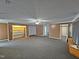 Large living room featuring built-in shelving and neutral carpeting at 3785 Little Creek Church Rd, Clayton, NC 27520