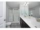 Bathroom featuring double sink vanity and a glass-enclosed shower, offering both style and functionality at 39 Principal Way, Clayton, NC 27520