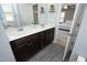 Double sink bathroom vanity with gray walls and view into main bedroom at 39 Principal Way, Clayton, NC 27520