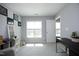 Bright bedroom featuring a large window for natural light and neutral walls and carpet at 39 Principal Way, Clayton, NC 27520