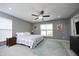 Spacious main bedroom featuring neutral walls, carpet, ceiling fan and large windows at 39 Principal Way, Clayton, NC 27520