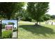 Scenic Clayton River Walk on the Neuse, featuring a paved trail and lush greenery, inviting for outdoor activity at 39 Principal Way, Clayton, NC 27520