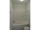 Bathroom with jacuzzi tub and tiled walls at 403 Gooseneck Dr # A-1, Cary, NC 27513