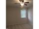 Bedroom featuring neutral carpet, ceiling fan, and natural light at 403 Gooseneck Dr # A-1, Cary, NC 27513