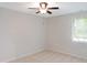 Comfortable bedroom with a ceiling fan, neutral walls and window at 403 Gooseneck Dr # A-1, Cary, NC 27513