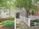 Inviting walkway leading to a condo with a beautiful porch and well-maintained landscaping at 403 Gooseneck Dr # A-1, Cary, NC 27513