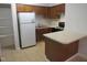 Functional kitchen featuring a peninsula island, and stainless steel appliances at 403 Gooseneck Dr # A-1, Cary, NC 27513