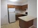 Functional kitchen featuring a peninsula island, and stainless steel appliances at 403 Gooseneck Dr # A-1, Cary, NC 27513