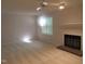 Bright living room with plush carpet, fireplace, and natural light at 403 Gooseneck Dr # A-1, Cary, NC 27513