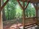 Covered porch with wooded backyard view at 403 Gooseneck Dr # A-1, Cary, NC 27513
